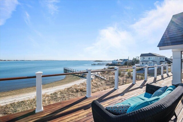 wooden deck featuring a water view