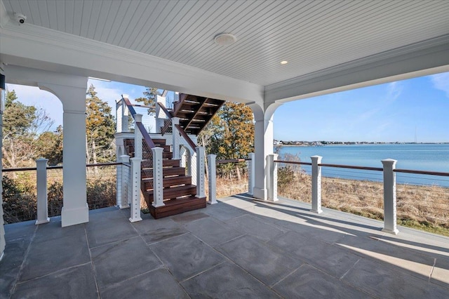 view of patio with a water view