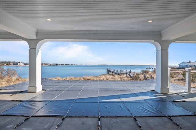 view of swimming pool with a water view