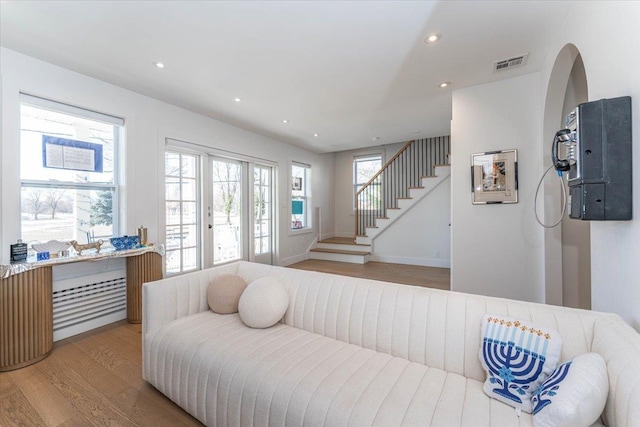 bedroom with light hardwood / wood-style flooring and french doors