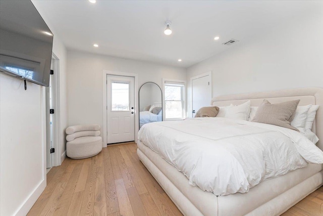 bedroom with light hardwood / wood-style floors