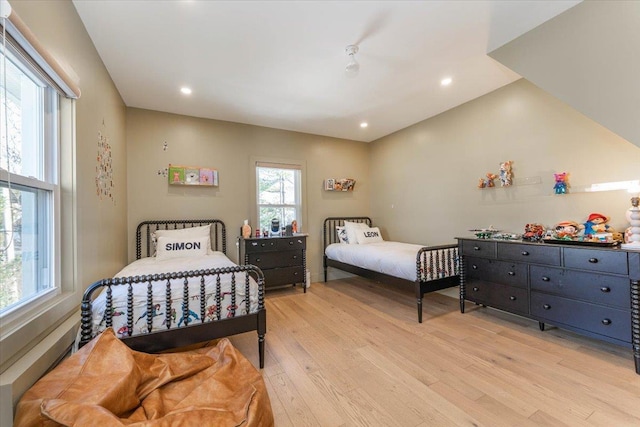 bedroom with light hardwood / wood-style floors