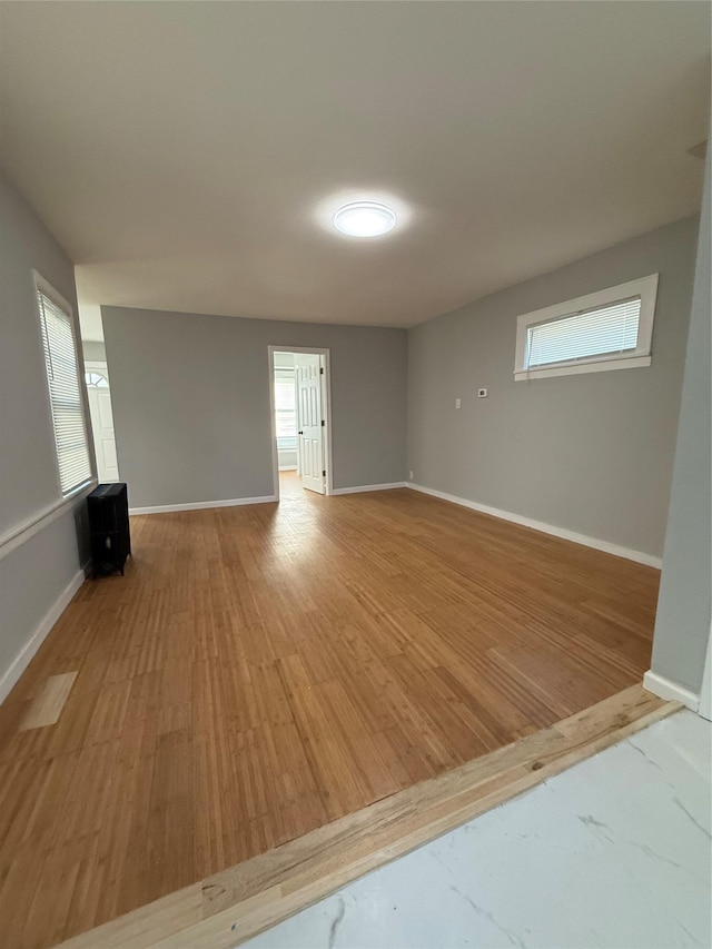 spare room featuring light hardwood / wood-style floors