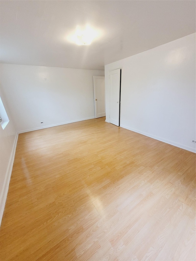 unfurnished room featuring light wood-type flooring