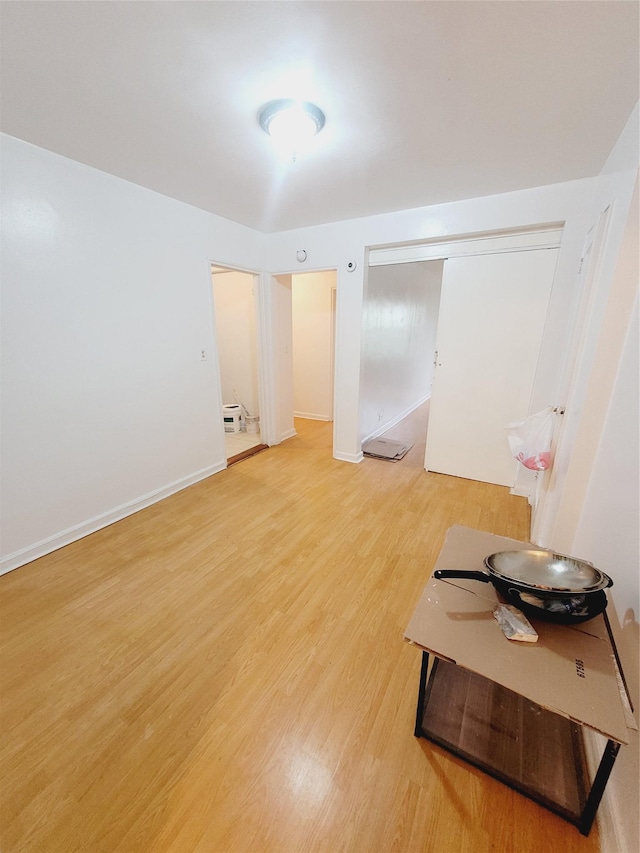 spare room with wood-type flooring