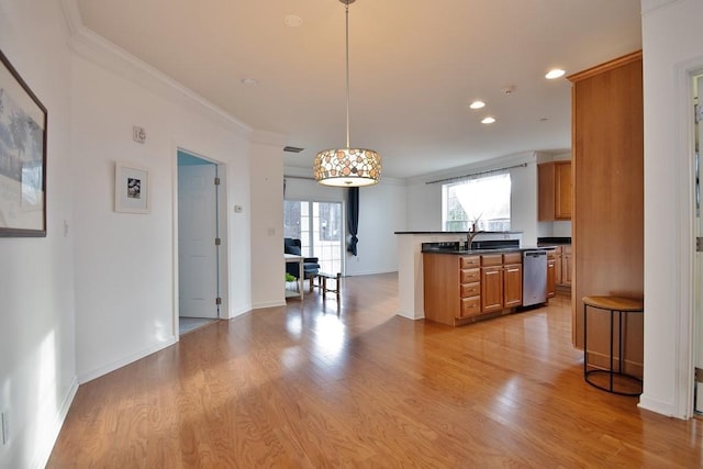 kitchen with dishwasher, decorative light fixtures, light hardwood / wood-style flooring, and ornamental molding