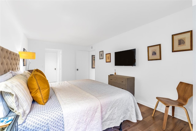 bedroom with hardwood / wood-style floors