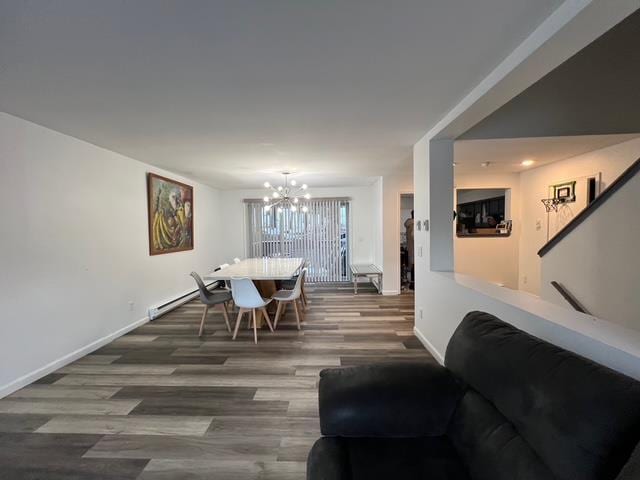 dining space featuring an inviting chandelier and dark hardwood / wood-style flooring