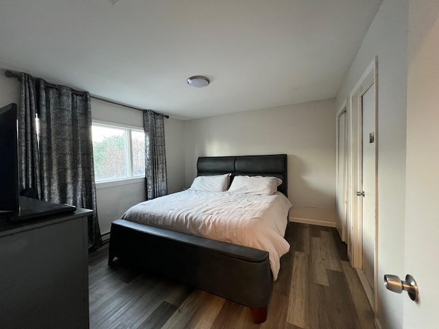 bedroom featuring dark wood-type flooring