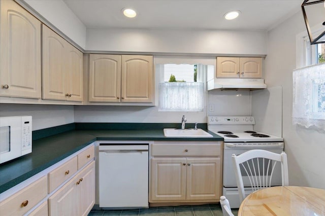 kitchen featuring a healthy amount of sunlight, white appliances, and sink