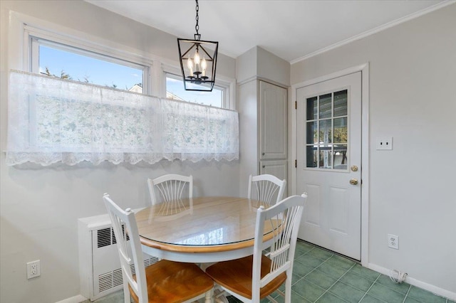 dining space with tile patterned floors, radiator heating unit, and an inviting chandelier