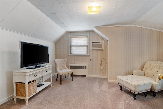 sitting room with a wall mounted air conditioner, carpet flooring, vaulted ceiling, and radiator