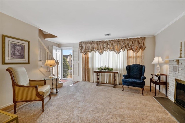 living area with carpet, crown molding, and a brick fireplace