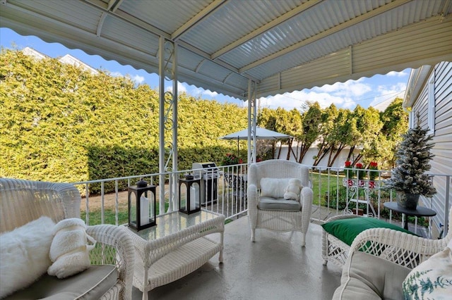 view of patio featuring a balcony