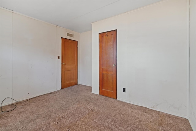 unfurnished room with light colored carpet