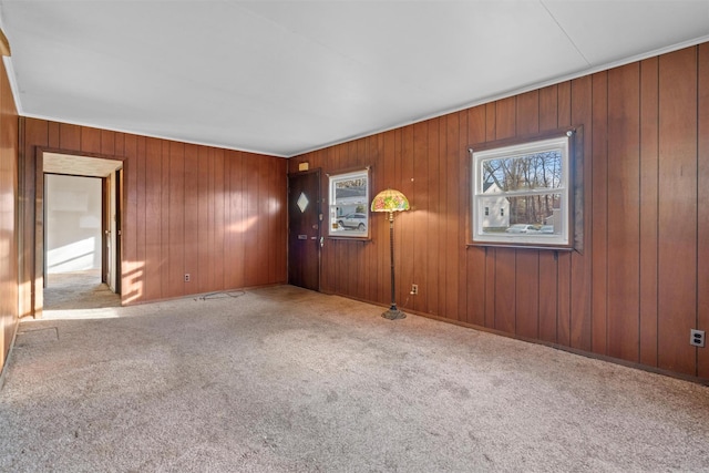 spare room featuring light colored carpet