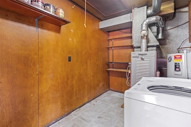 laundry area featuring washer / clothes dryer and electric water heater