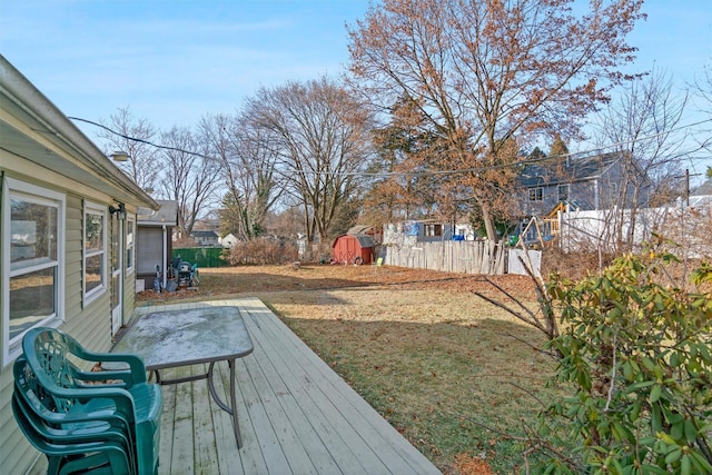 view of yard with a deck and a storage shed