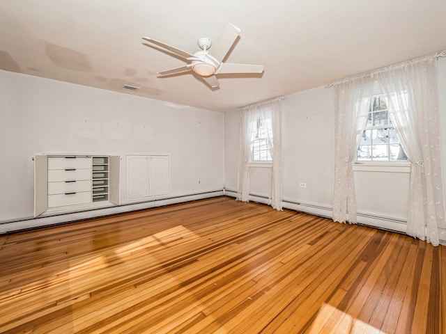 unfurnished room with light hardwood / wood-style flooring and ceiling fan