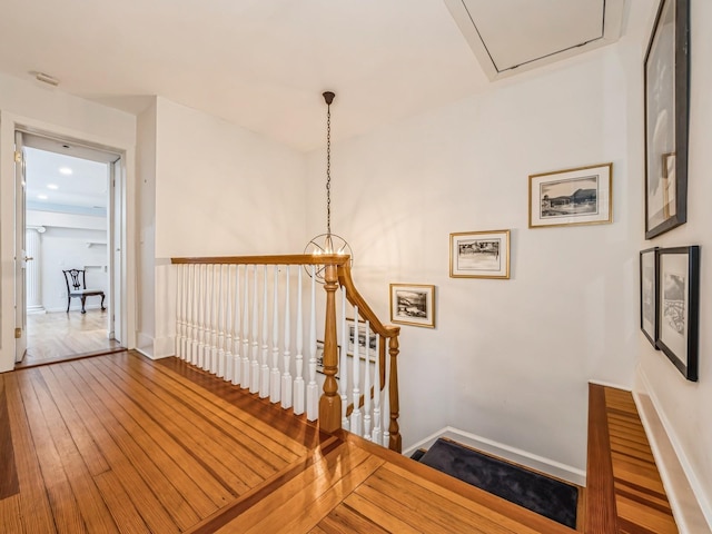 stairs featuring wood-type flooring and baseboards