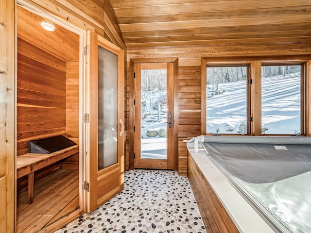 bathroom featuring wooden ceiling, wood walls, lofted ceiling, and a sauna