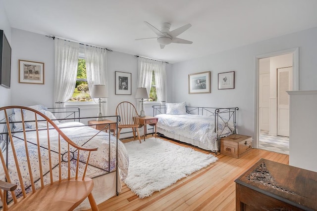 bedroom with hardwood / wood-style floors and ceiling fan