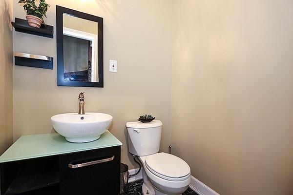 bathroom featuring toilet and vanity