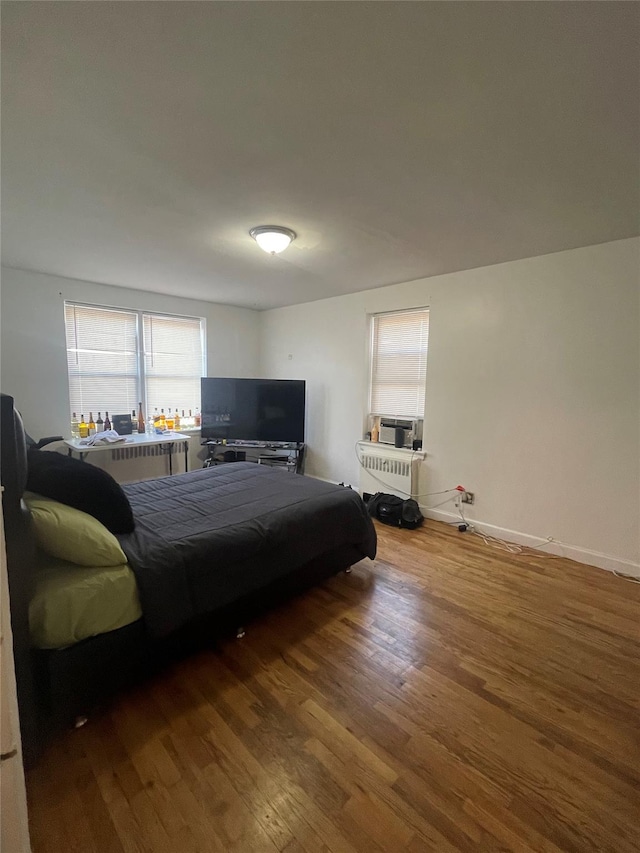 bedroom with wood-type flooring