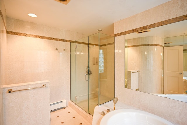 bathroom featuring shower with separate bathtub, tile patterned floors, and baseboard heating