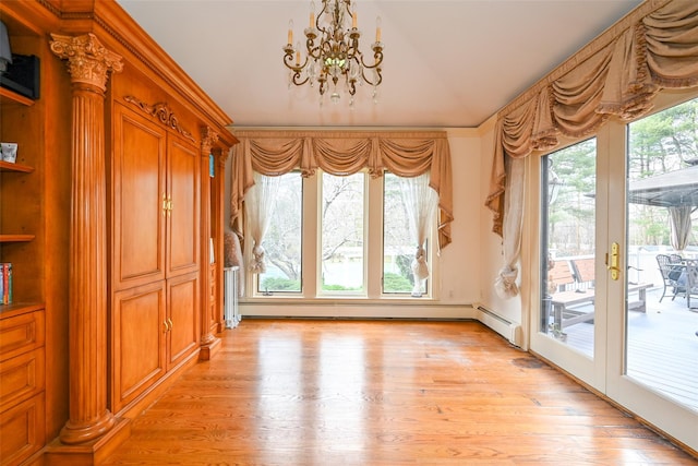 interior space featuring an inviting chandelier, light hardwood / wood-style flooring, baseboard heating, and ornamental molding