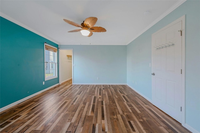 empty room featuring dark hardwood / wood-style floors, ceiling fan, and ornamental molding