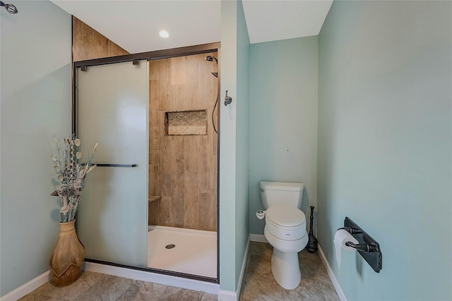 bathroom with toilet and walk in shower