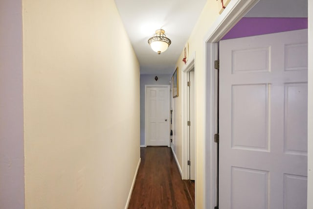 corridor featuring dark wood-type flooring