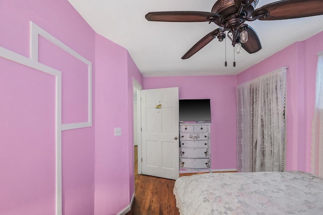 unfurnished bedroom with dark hardwood / wood-style flooring and ceiling fan