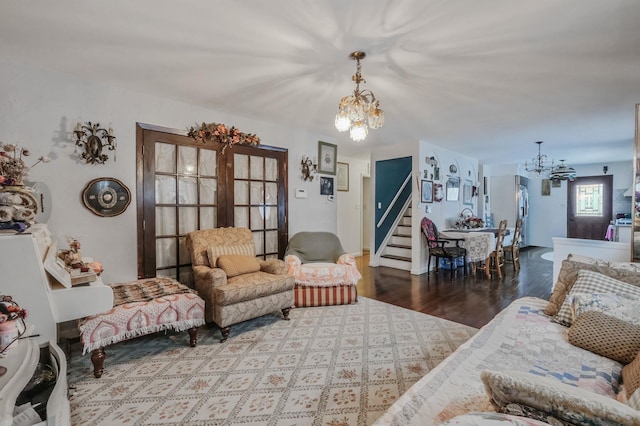 living room with hardwood / wood-style floors and a chandelier