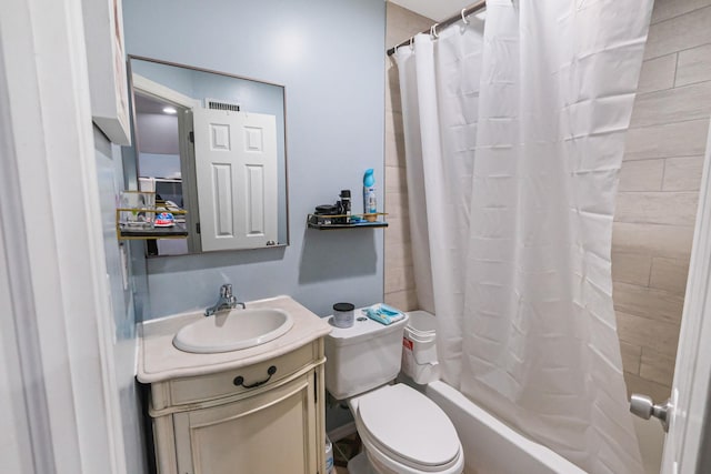 full bathroom featuring vanity, shower / bath combo, and toilet