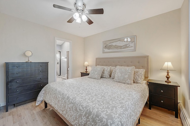 bedroom with ceiling fan, ensuite bathroom, light wood-type flooring, and baseboard heating