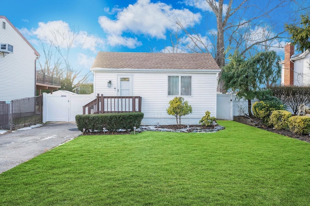 bungalow-style house featuring a front yard