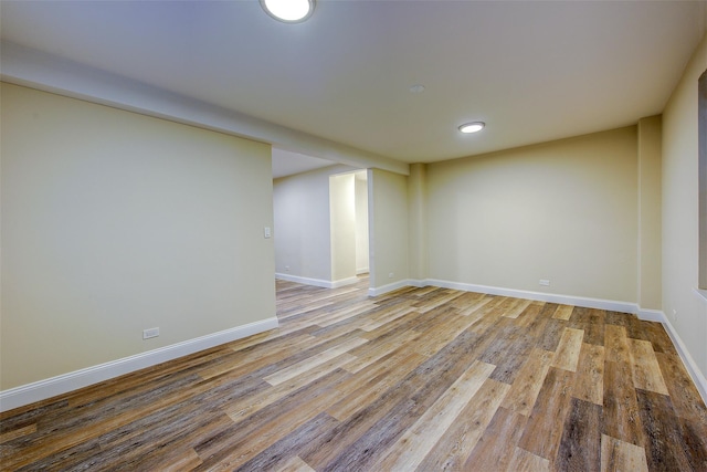 basement with light hardwood / wood-style floors