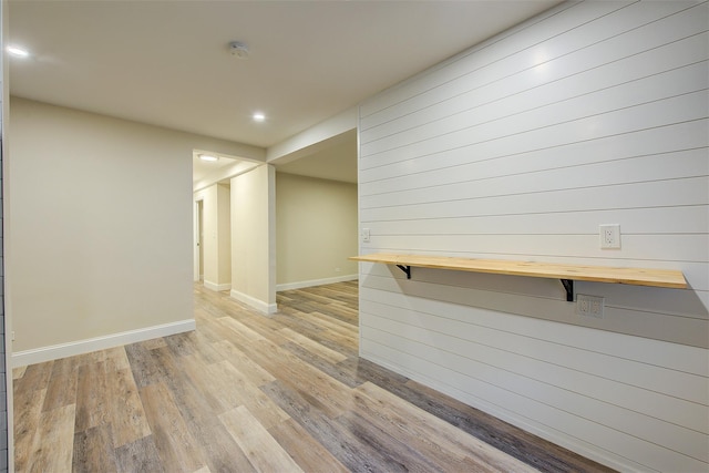 empty room with light hardwood / wood-style flooring