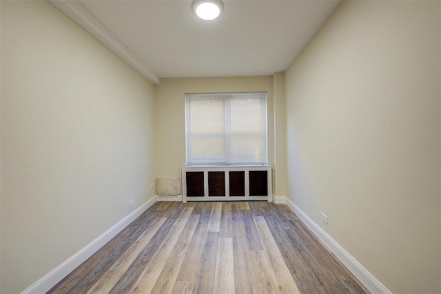 unfurnished room with hardwood / wood-style floors