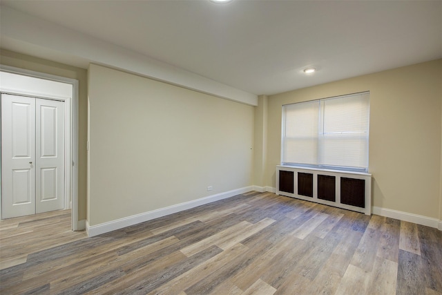 empty room featuring hardwood / wood-style floors