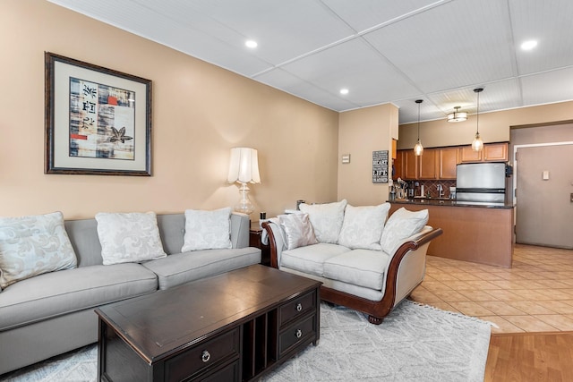 living room with light hardwood / wood-style flooring