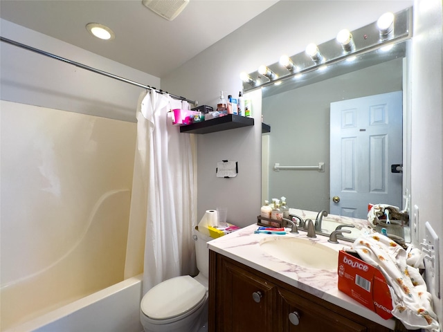 full bathroom with shower / bath combo, vanity, and toilet