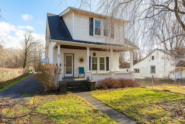 view of front of house featuring a porch and a front lawn