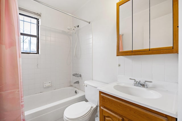 full bathroom with decorative backsplash, toilet, shower / bath combo, and vanity