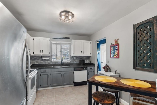202 Essex Ct, Brewster, NY 10509 - kitchen featuring tasteful backsplash, gray cabinetry, white appliances, sink, and white cabinets