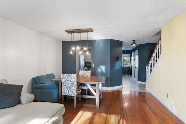 202 Essex Ct, Brewster, NY 10509 - dining area with hardwood / wood-style flooring and a textured ceiling