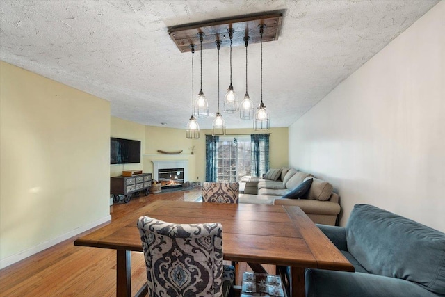 202 Essex Ct, Brewster, NY 10509 - dining room featuring hardwood / wood-style floors and a textured ceiling