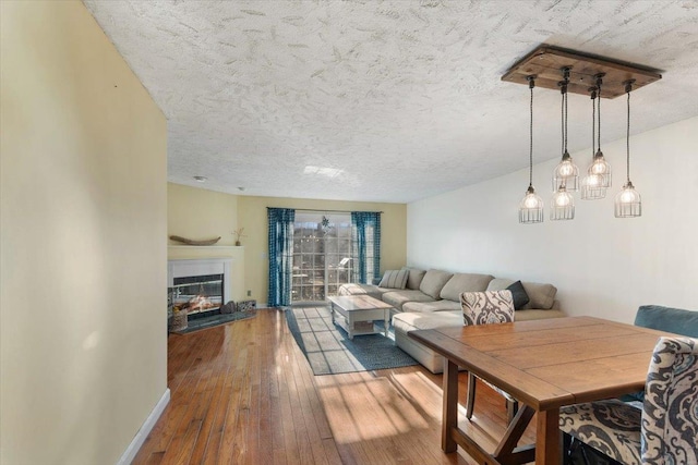 202 Essex Ct, Brewster, NY 10509 - dining space featuring hardwood / wood-style floors and a textured ceiling